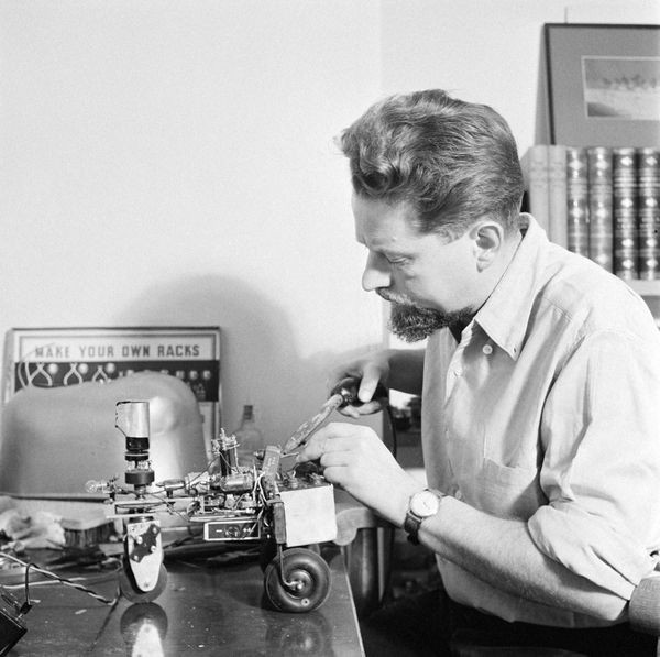 William Grey Walter working on his Elsie 'tortoise' robot.